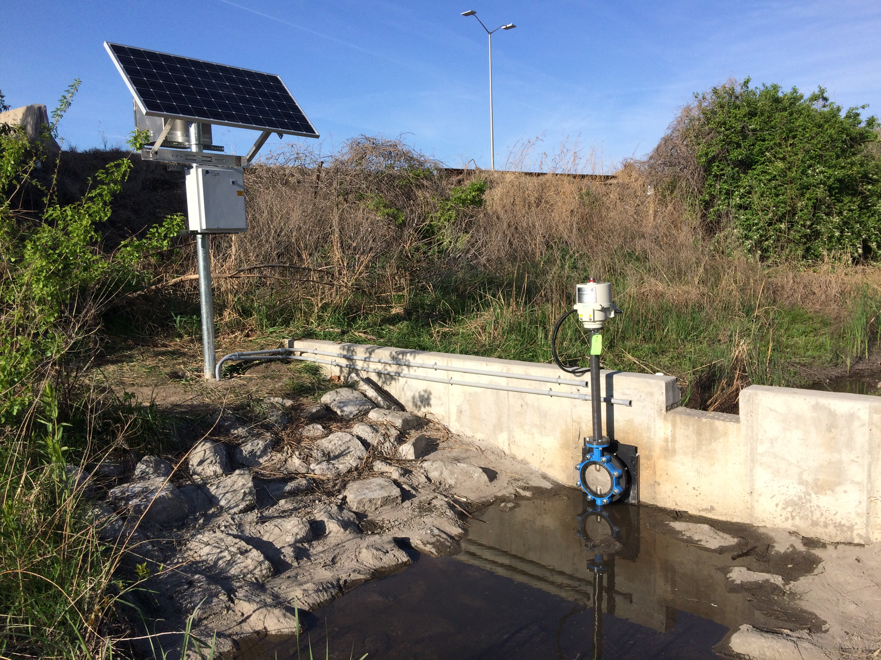 A ProMation Engineering electric actuator installed outdoors.